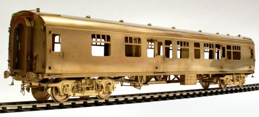 CK coach in unpainted brass